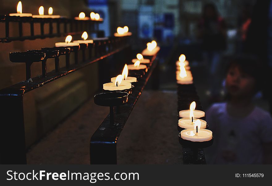 White Tealight Candles Lit during Nighttime
