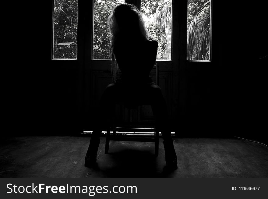 Woman Sitting on Chair