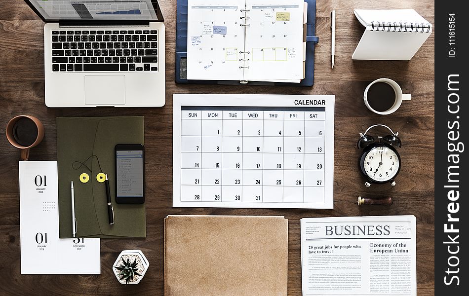 Laptop, Calendar And Books