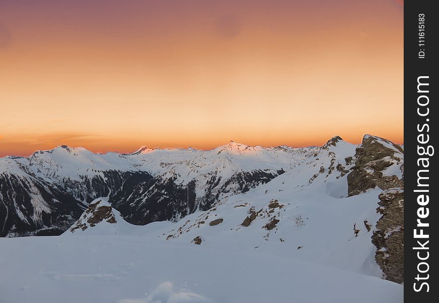 Mountain Covered With Snow During Sunset