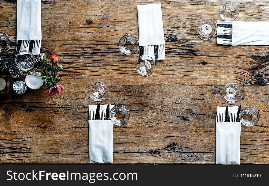 High-angle Photography of Utensils With Napkins