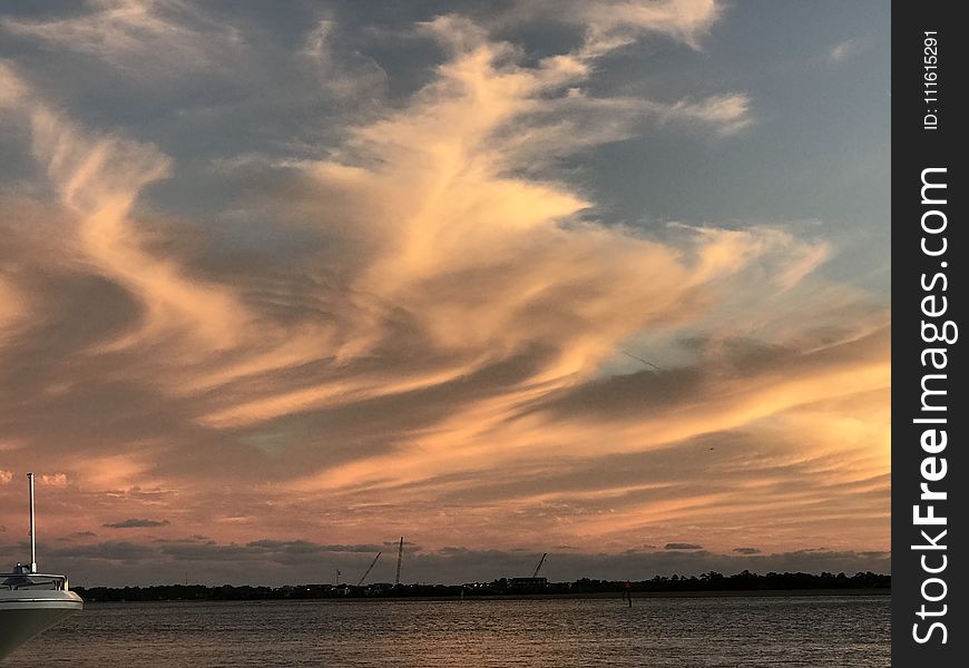 Photography White Boat on Body of Water during Sunset