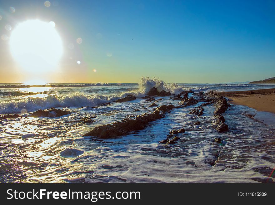 Portrait Photography Of Seashore And Sun