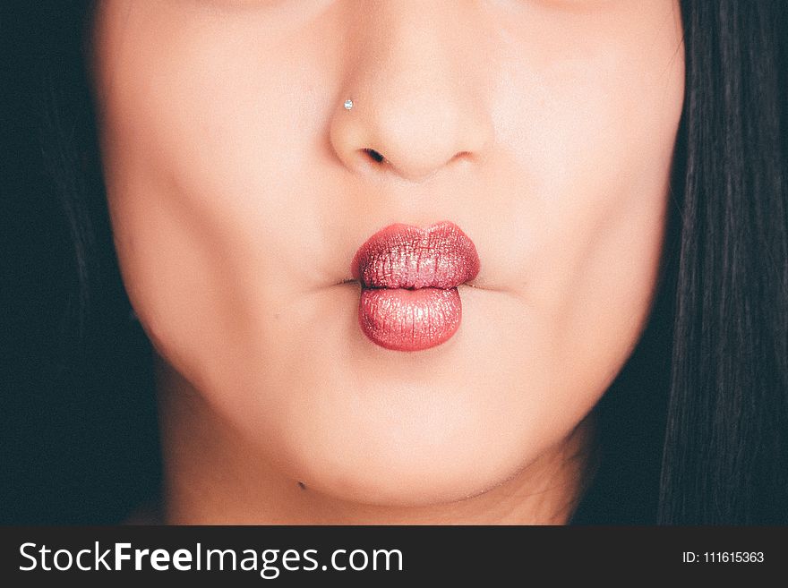 Woman Wearing Red Lipgloss