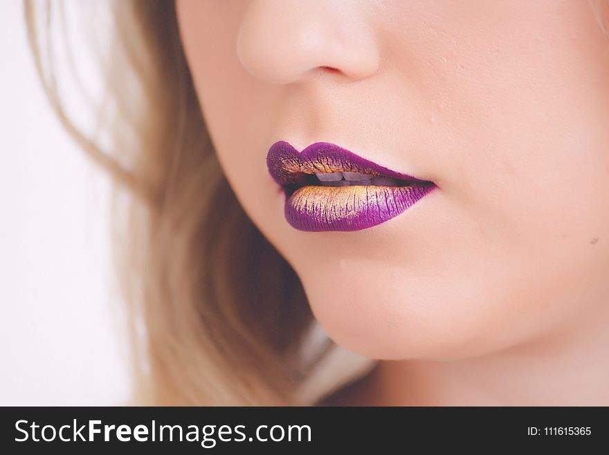 Woman Wearing Purple And Beige Lipstick