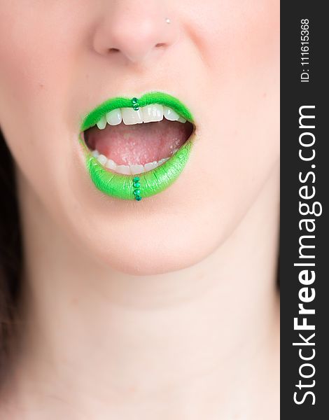 Woman Wearing Green Lipstick With an Open Mouth