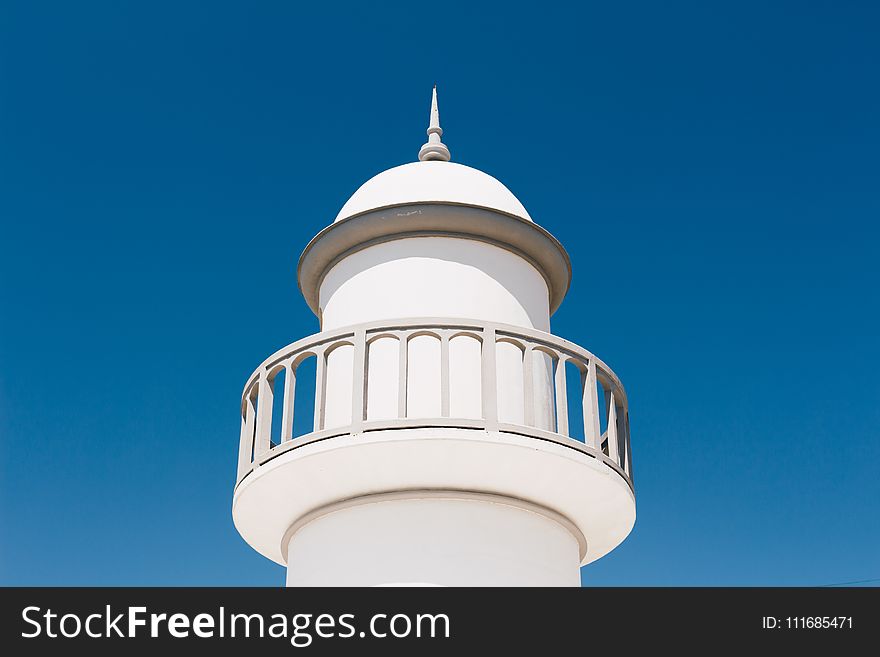 White Lighthouse Under Blue Sky
