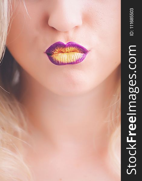 Woman Wearing Purple and Yellow Lipstick