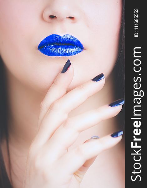 Woman Wearing Blue Lipstick and Manicure