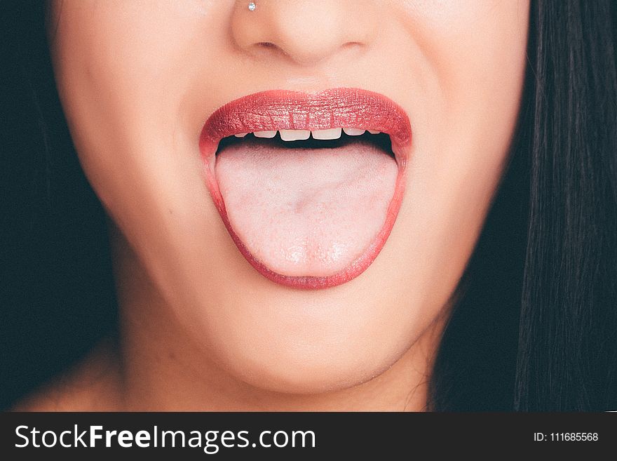 Woman With Wide Open Mouth and Tongue Out