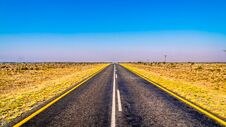 Long Straight Road Through The Endless Wide Open Landscape Of The Semi Desert Karoo Region In Free State And Eastern Cape Province Stock Image