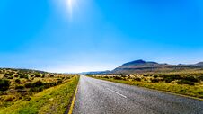 Long Straight Road Through The Endless Wide Open Landscape Of The Semi Desert Karoo Region In Free State And Eastern Cape Province Royalty Free Stock Photography