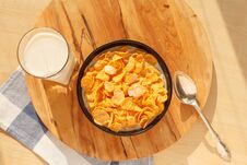 Cornflakes Breakfast Cereal In The Bowl With Glass Of Milk On Wood Table Royalty Free Stock Photography Cornflakes Breakfast Cereal In The Bowl With Glass Of Milk On Wood Table Royalty Free Stock Photography