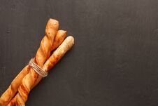 Baguettes Tied By Jute Twine On Black Background Stock Photos