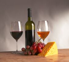 Still Life With Glass And Bottle Of Wine, Cheese And Grapes Royalty Free Stock Images