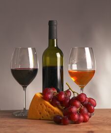 Still Life With Glass And Bottle Of Wine, Cheese And Grapes Royalty Free Stock Image