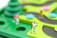Miniature People : Golfer Stand With Children`s Toys Collection, Royalty Free Stock Photo Miniature People : Golfer Stand With Children`s Toys Collection, Royalty Free Stock Photo