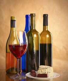 Still Life With Glass And Bottle Of Wine, Cheese And Grapes Stock Image