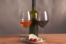 Still Life With Glass And Bottle Of Wine, Cheese And Grapes Stock Photos