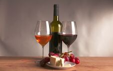 Still Life With Glass And Bottle Of Wine, Cheese And Grapes Stock Images