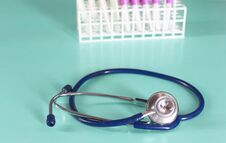 Doctor`s Workspace Working Table With Patient`s Discharge Blank Paper Form, Medical Prescription, Stethoscope On Desk Stock Photo
