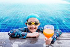 Happy Children At The Swimming Pool Side, Girl Relaxing With Sum Stock Image