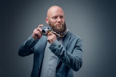A Man Shooting With Vintage SLR Photo Camera. Royalty Free Stock Photography