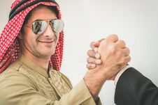 Arab Businessman And Businessman Worker Handshaking Stock Images