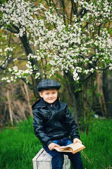 Boy On A Walk In The Garden In The Spring Stock Photo