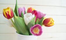 Easter. Pink Easter Eggs And Tulips Lie On A Wooden Background. Flat Lay. Stock Photo
