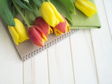 Tulips Are Yellow And Orange. Wooden Background. Spring Flowers. Royalty Free Stock Photos