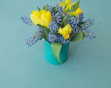 Bouquet Of Daffodils, Tulips And Muscari.Easter. Easter Eggs Are Blue And Turquoise. Stock Photos