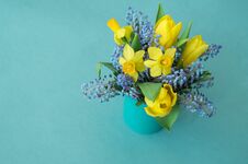Bouquet Of Daffodils, Tulips And Muscari.Easter. Easter Eggs Are Blue And Turquoise. Royalty Free Stock Image