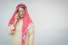 Arab Businessman Useing On A Mobile Phone Royalty Free Stock Image