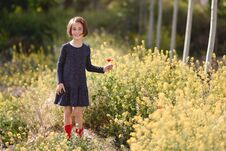 Little Girl Walking In Nature Field Wearing Beautiful Dress Stock Photography