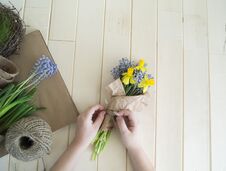 Children`s Hands Collect A Bouquet As A Gift. A Gift For Mom. Royalty Free Stock Images