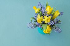 Bouquet Of Daffodils, Tulips And Muscari.Easter. Easter Eggs Are Blue And Turquoise. Royalty Free Stock Photography