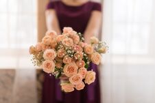 Girl Hold A Bouquet Of Cream Roses. Royalty Free Stock Photo