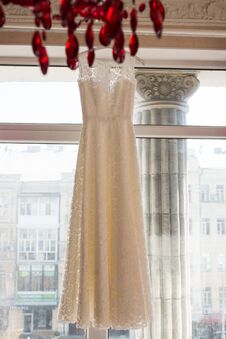 Wedding Dress On Hanger On A Window. Beautiful Gown. Stock Images