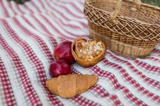 Romantic Picnic In The Garden - A Basket With Bakery And Apples. Picnic On The Lawn. Objects For Picnic On A Coverlet. . Stock Image