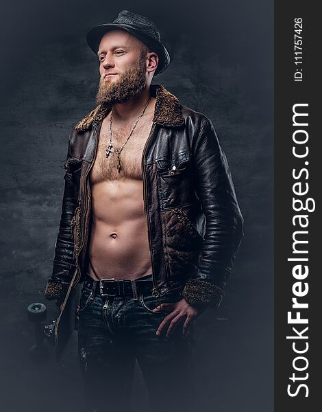 Bearded Man Wearing A Leather Jacket On Naked Torso.