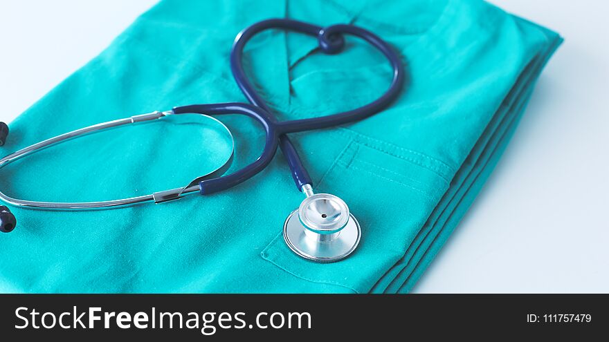 A Stethoscope Shaping A Heart On A Medical Uniform, Closeup