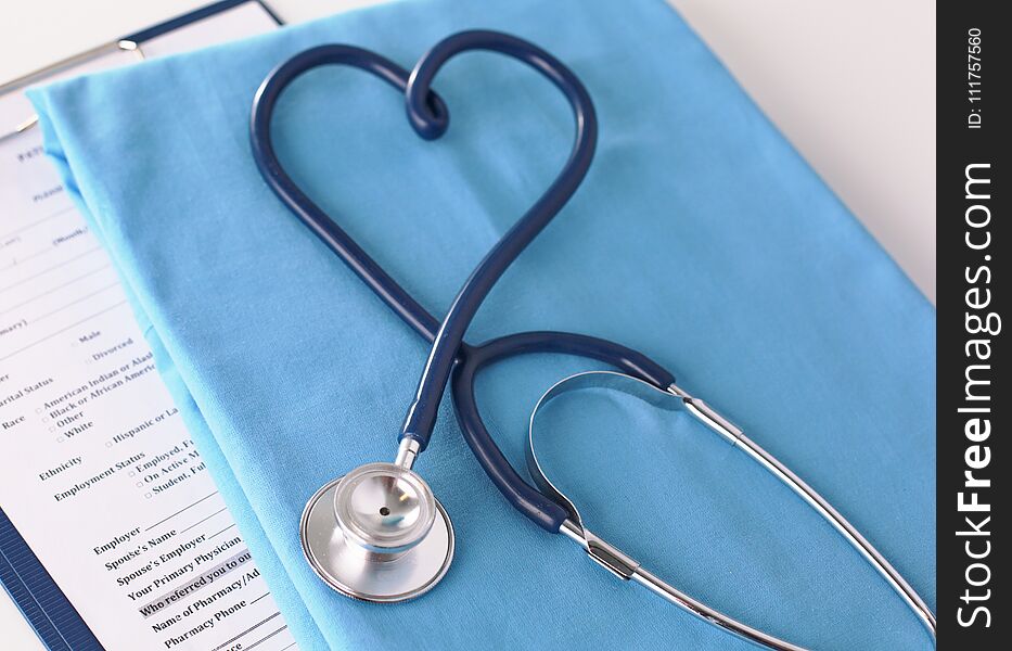 A Stethoscope Shaping A Heart On A Medical Uniform, Closeup