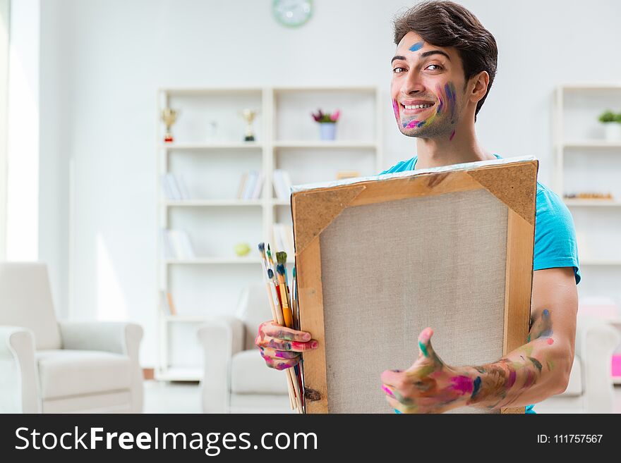 The Young Funny Artist Working On New Painting In His Studio