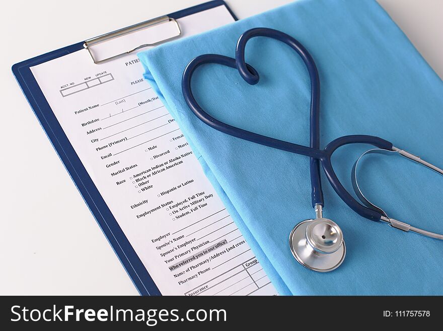 A Stethoscope Shaping A Heart On A Medical Uniform, Closeup