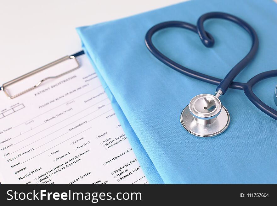 A Stethoscope Shaping A Heart On A Medical Uniform, Closeup