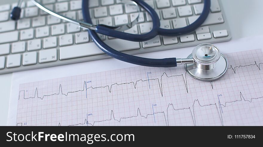 Stethoscope On Cardiogram Concept For Heart Care On The Desk.blue Toned Images