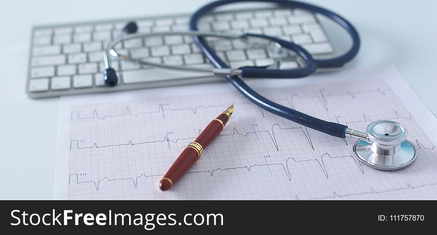 Stethoscope on cardiogram concept for heart care on the desk.blue toned images