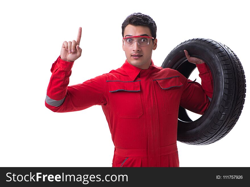 Young tyre repairman in red coveralls isolated on white backgrou