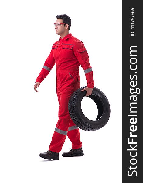 Young tyre repairman in red coveralls isolated on white background